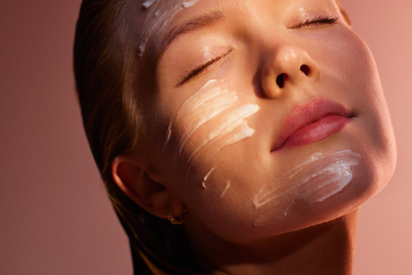 A woman with skincare on her face to keep her skin hydrated