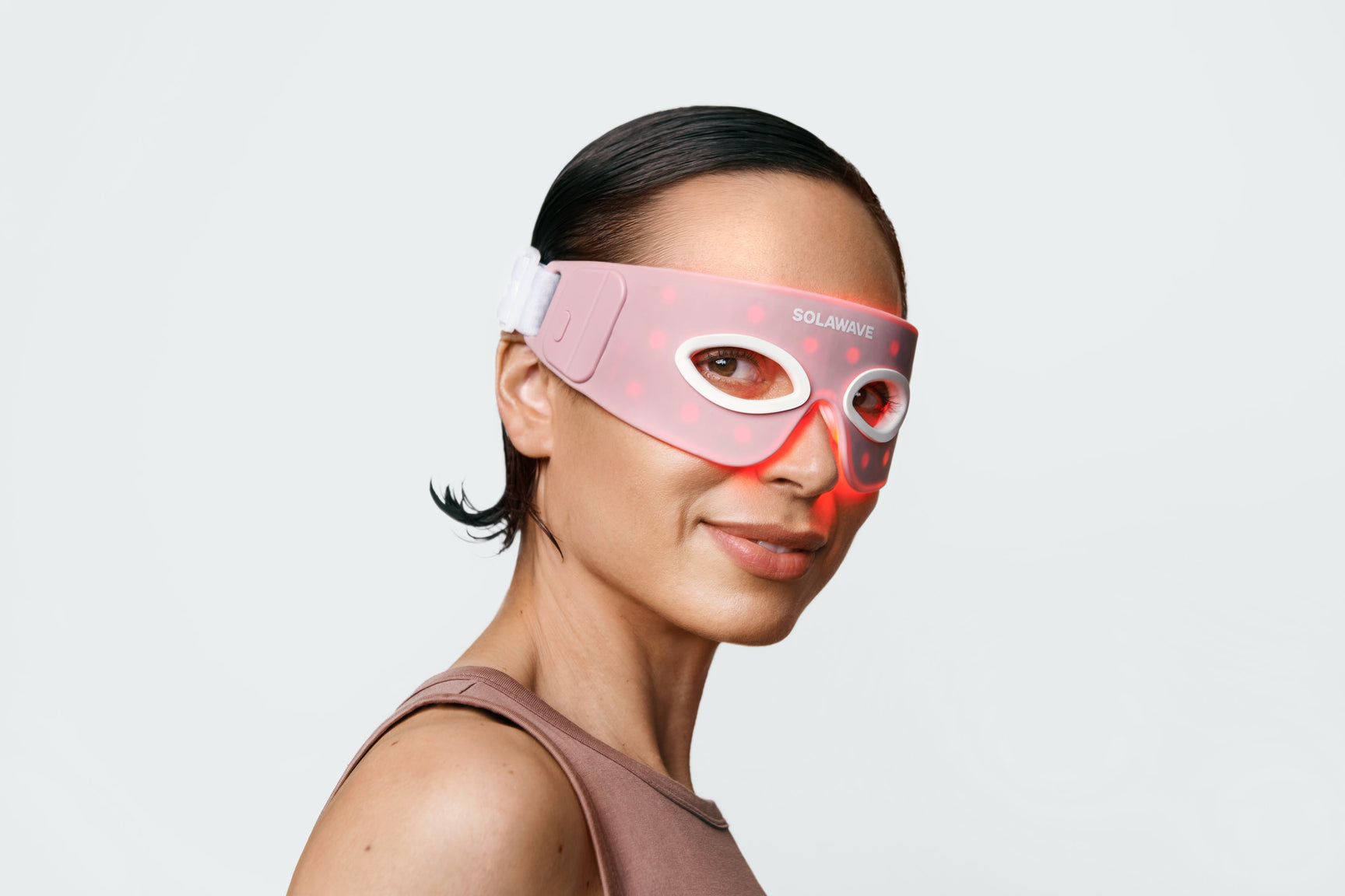 An image of a woman wearing the Solawave red light therapy eye mask