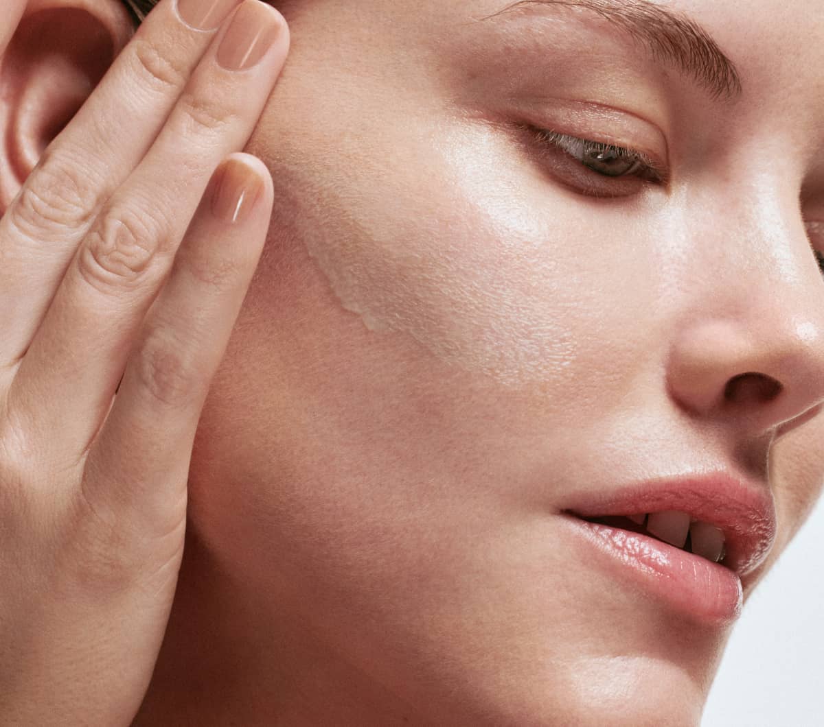 Woman applying skincare topicals for FSA and HSA usage