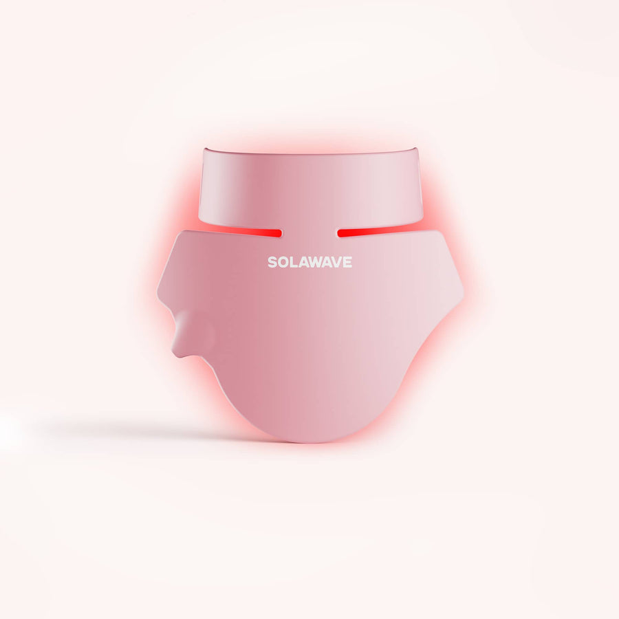 The Solawave Neck & Chest Rejuvenating Mask, shown with glowing red light on a neutral background, is perfect for fans of light therapy masks seeking effective skin-firming treatments. || Rose