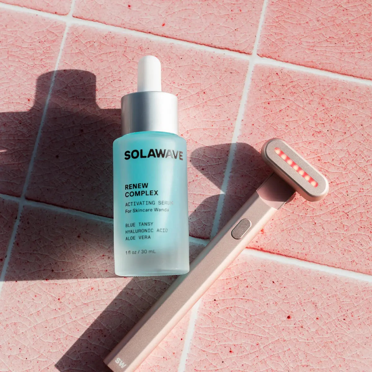 An image of the Solawave red light therapy wand and the activating serum