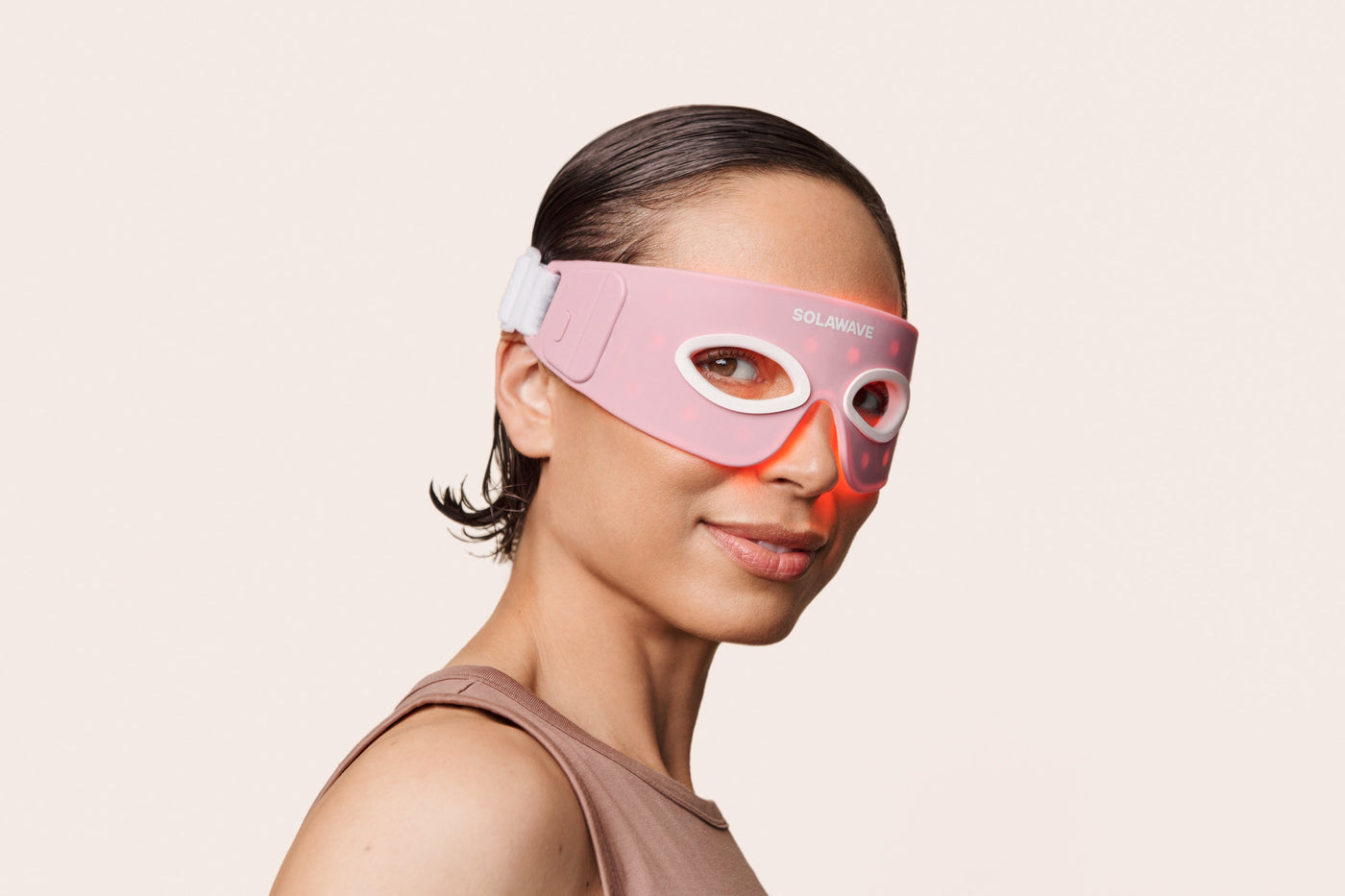 An image of a woman wearing the Solawave red light therapy eye mask