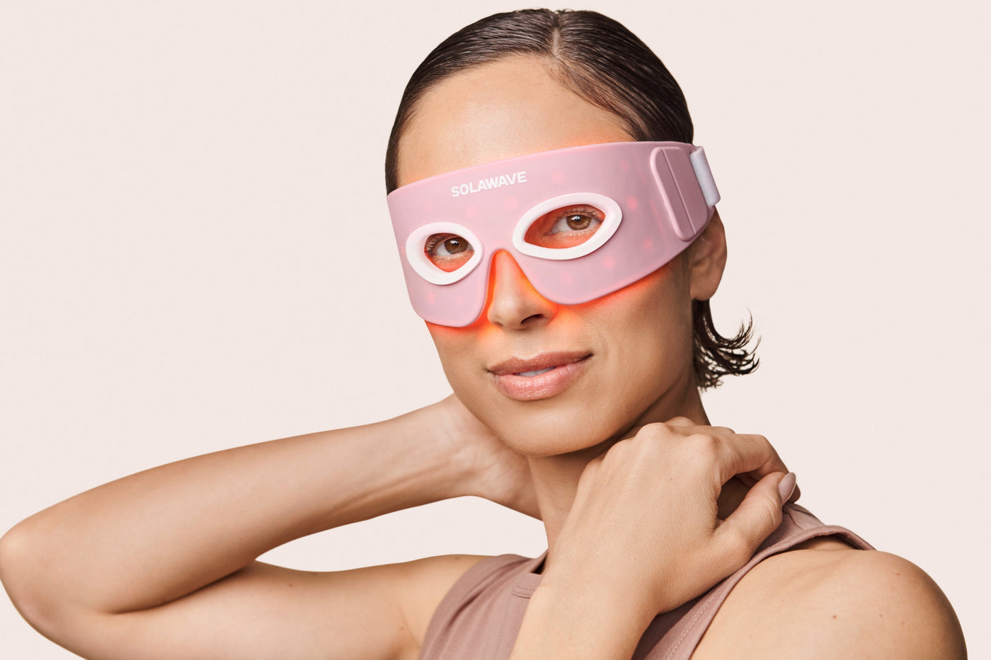 A woman wearing red light therapy eye mask to treat 11 lines