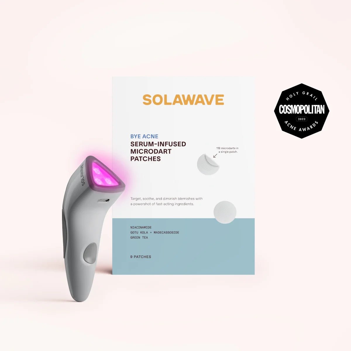 A compact device with a glowing tip beside the Bye Acne Pro Kit by SolaWave (charcoal) is perfect for light therapy. The Cosmopolitan 2023 award emblem stands out on the package containing 9 serum-infused microdart patches, ideal for blemish control. || Charcoal