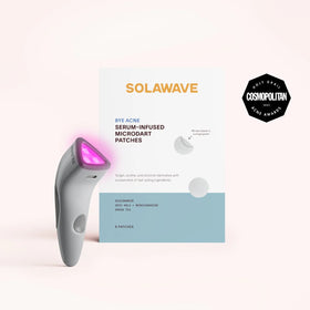 A compact device with a glowing tip beside the Bye Acne Pro Kit by SolaWave (charcoal) is perfect for light therapy. The Cosmopolitan 2023 award emblem stands out on the package containing 9 serum-infused microdart patches, ideal for blemish control. || Charcoal