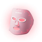 The Solawave Wrinkle Retreat Red Light Therapy Face Mask features a pink design with eye, nose, and mouth openings and emits red light for visible wrinkle reduction and anti-aging benefits.