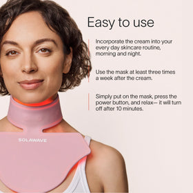 A person wearing a pink LED light therapy neck and chest mask. Text beside them reads: Solawave Neck & Chest LED Mask w/ LightBoost Cream Kit: Use the cream morning and night, then the mask 3 times a week. It turns off after 10 minutes for easy use. || Rose