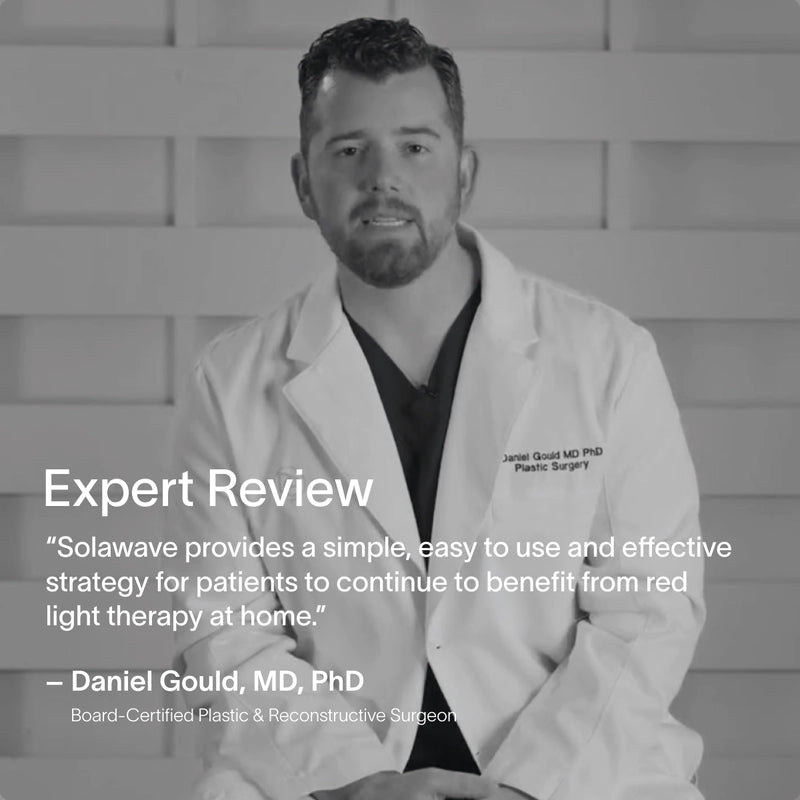 A board-certified plastic and reconstructive surgeon in a white coat is seated against a textured wall beside a quote about the Solawave Neck & Chest LED Mask w/ LightBoost Cream Kit. Benefits like Red Light Therapy are highlighted, and the grayscale image gives it a timeless appeal. || Rose