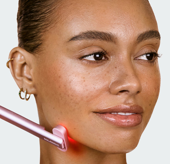 Solawave rose-gold 4-in-1 wand — on-model lifestyle