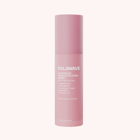 Pink cylindrical bottle labeled "Solawave Lightboost Wand Activating Serum" with white text on pale background.