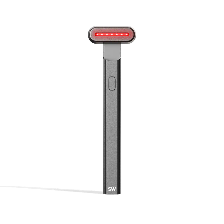 4-in-1 Radiant Renewal Skincare Wand with Red Light Therapy - in charcoal features a minimalist design, flat rounded head, and red LED light to help reduce fine lines with advanced skincare tech and simple one-button control. || charcoal